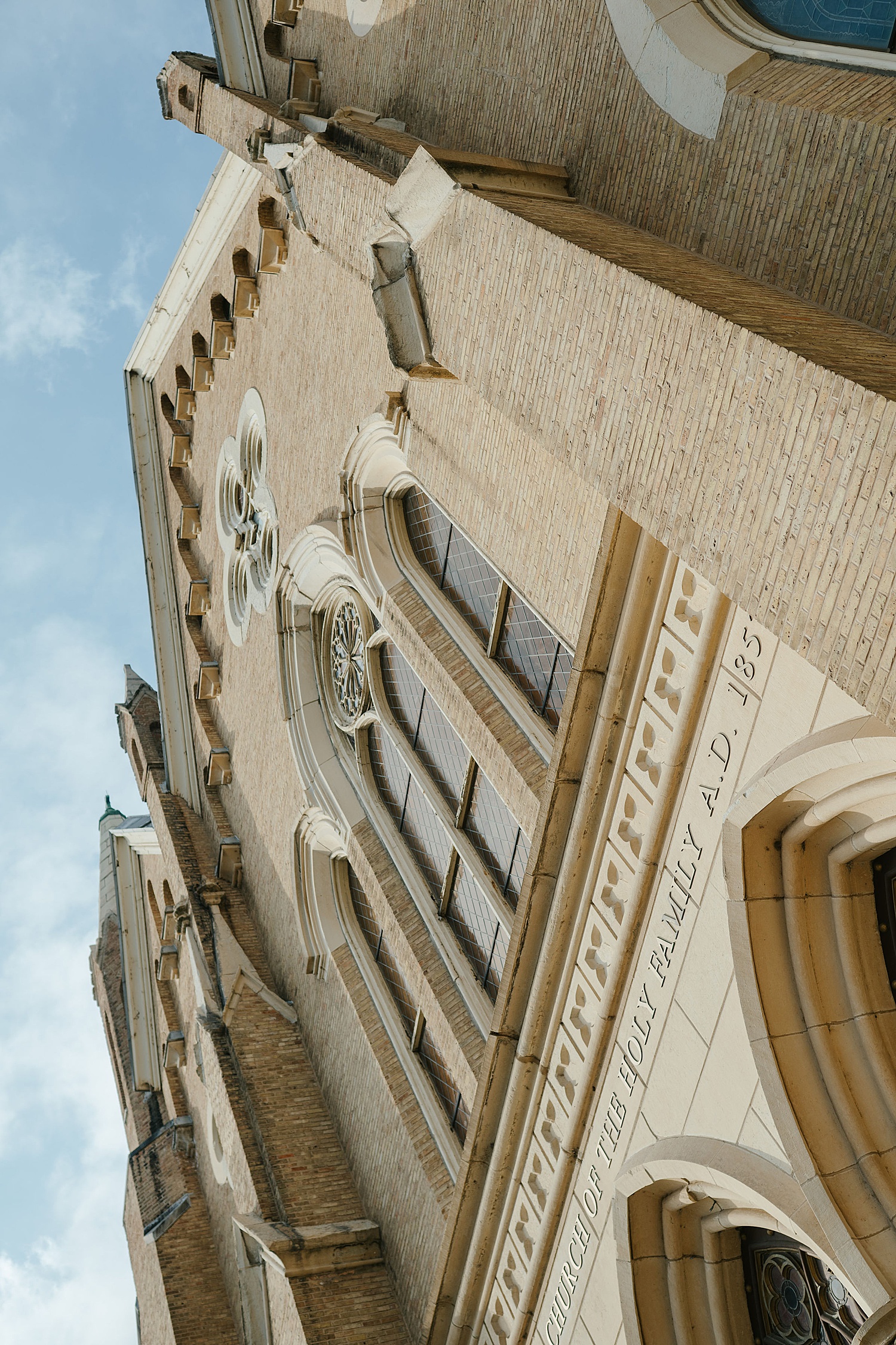 large Catholic Church juts into sky by Chicago wedding photographer
