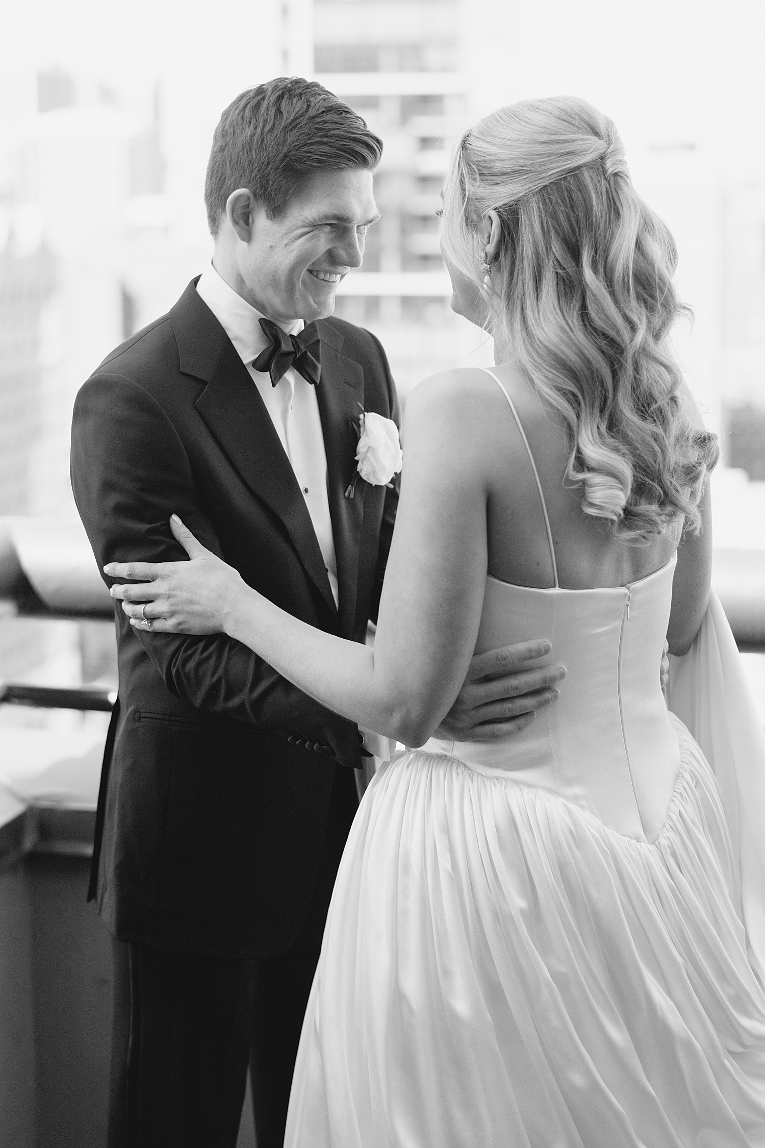 groom grins at his bride during first look at Lincoln Park venue
