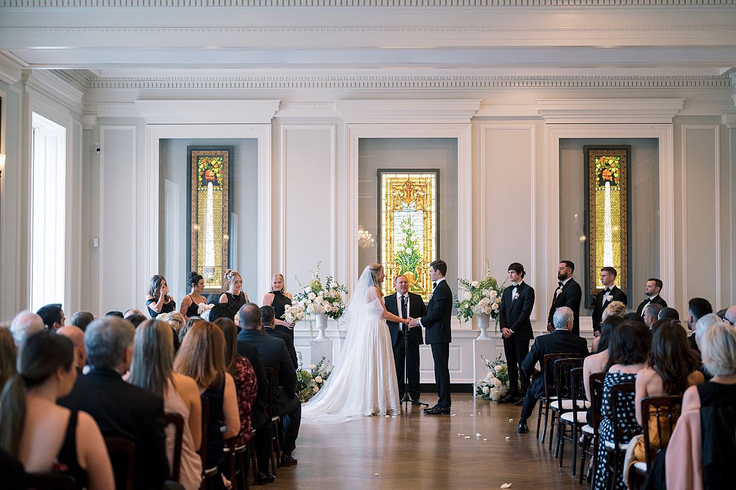 couple holds hands at the alter at Lincoln Park venue